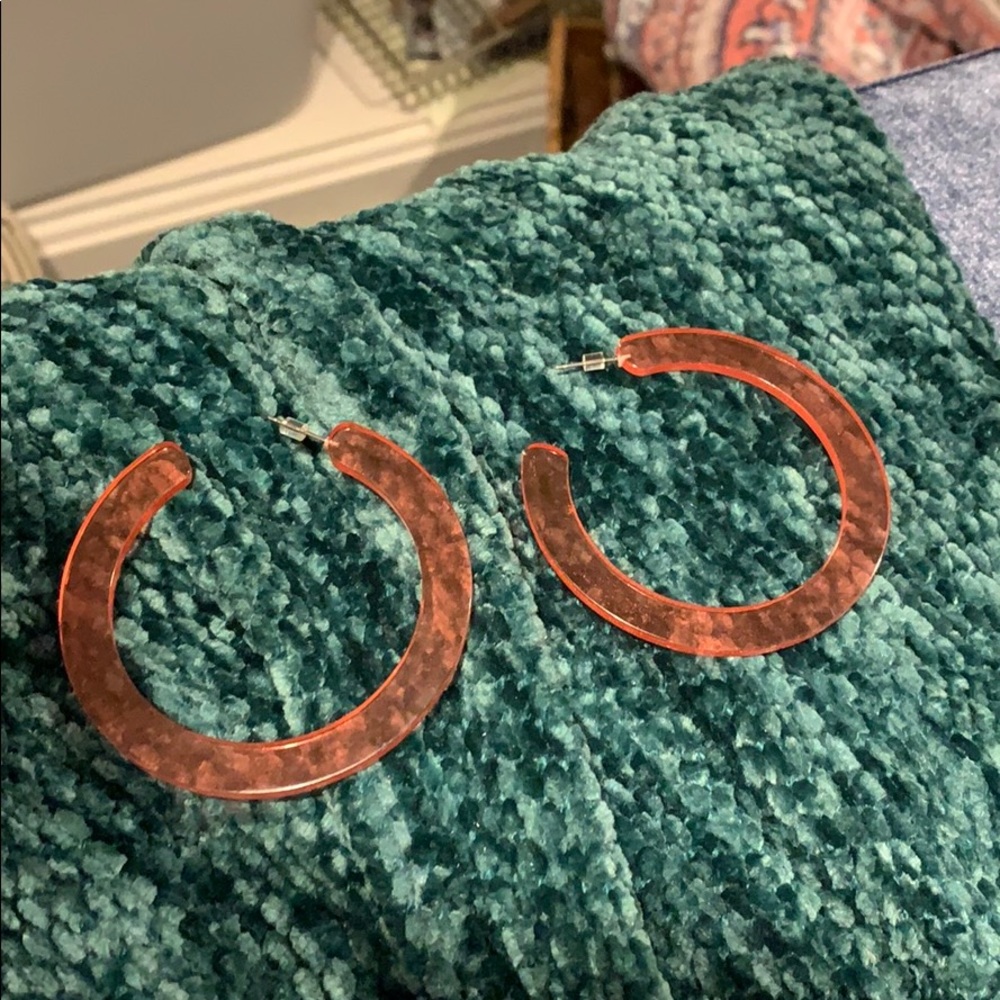 Pinky red plastic hoops, lightweight and fun!